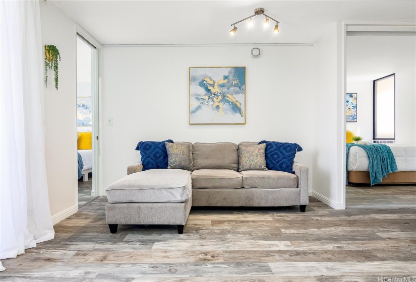 View of living room and access to each bedroom. Master bedroom located on the left and guest/other bedroom on the right hand side.