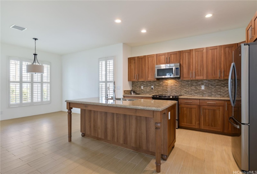 The kitchen is spacious with lots of areas to do your meal prep