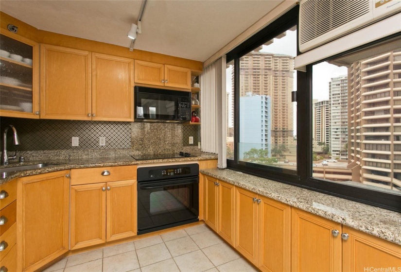 The kitchen also features with a view of the city.