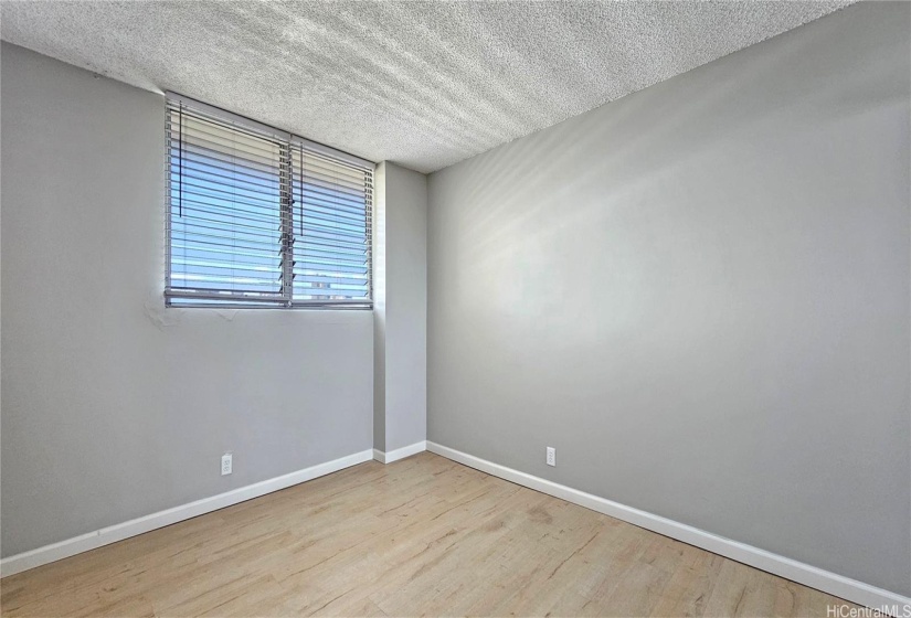 Newly painted bedroom. Note: Walls have been refinished (smoothed)