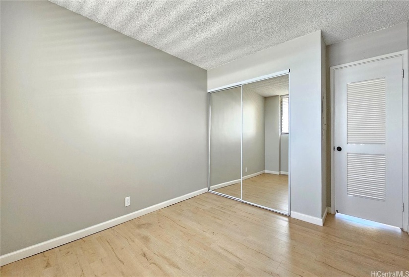 Newly painted bedroom. Note: Walls have been refinished (smoothed)