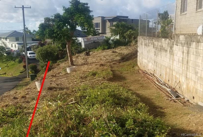 Looking down the driveway.  The red line shows the property line up against the City & County Setback. (line is approximate)