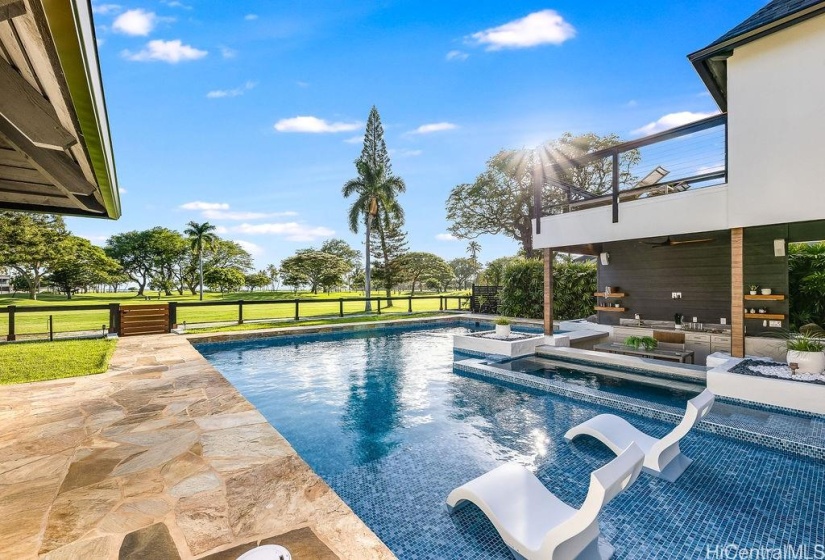 Saltwater pool with two swim up bars