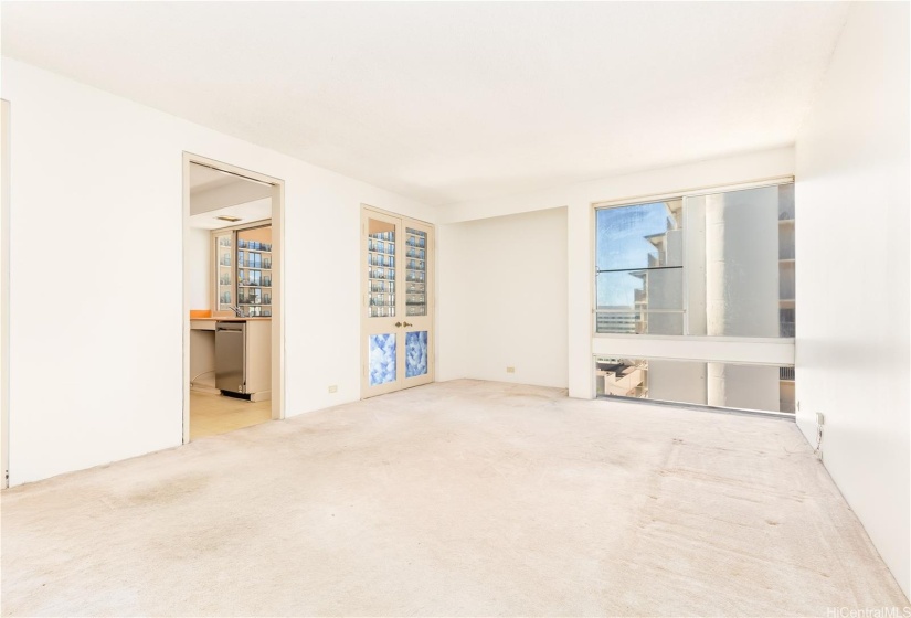 Bright natural light with double glass doors to the lanai (from the living room