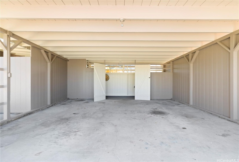 Garage with bonus covered outdoor shower and lots of storage for your water sports equipment