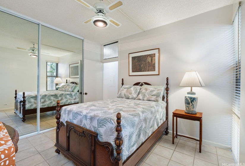 Guest bedroom number two with floor to ceiling mirrored closets!