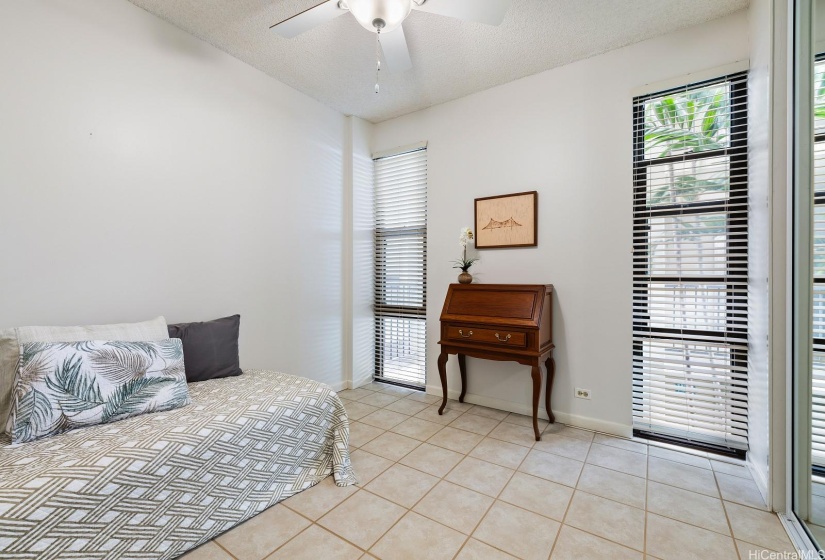 Guest bedroom number three is being used as an office, also has floor to ceiling mirrored closets