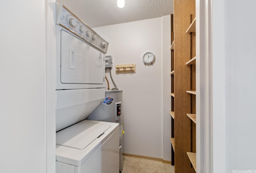 Separate room with washer, dryer and hot water heater!