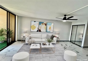 Spacious living room extends to the lanai virtually staged