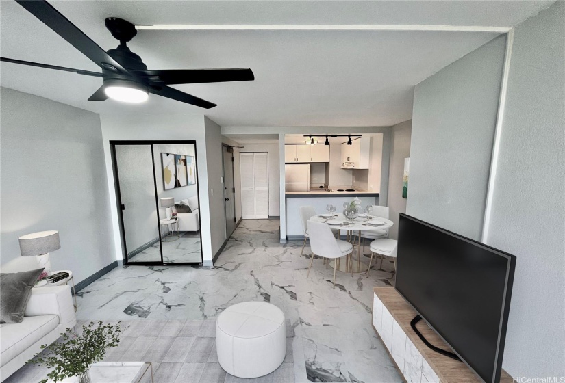 Living room opens to kitchen and dining area Virtually staged