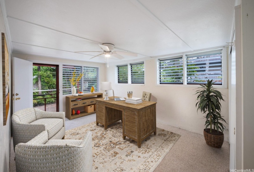 Area off the primary bedroom with separate entrance. Virtually Staged.