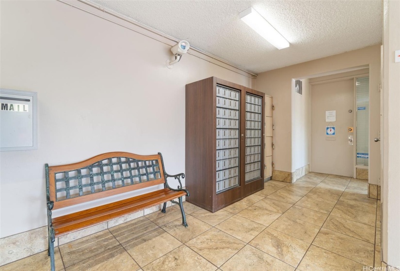 Clean, comfortable and secure lobby area with mailboxes.  The resident manager's office conveniently located in the lobby.  The meeting/rec room and pool can be access through the door just to the right of the resident manager's office door.