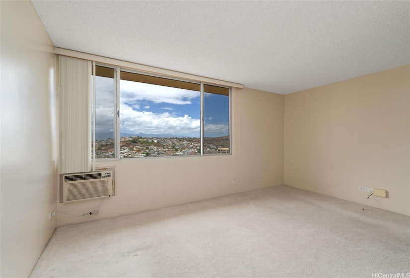 Living room window provides lots of light and great views!  Open the windows for cool tropical breezes or keep them closed and use AC on those hot calm days.  Window AC units are included with unit and may not cool to displayed temperature setting.