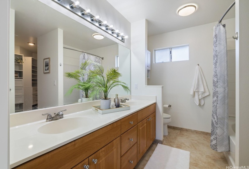 The primary bathroom has double vanities.