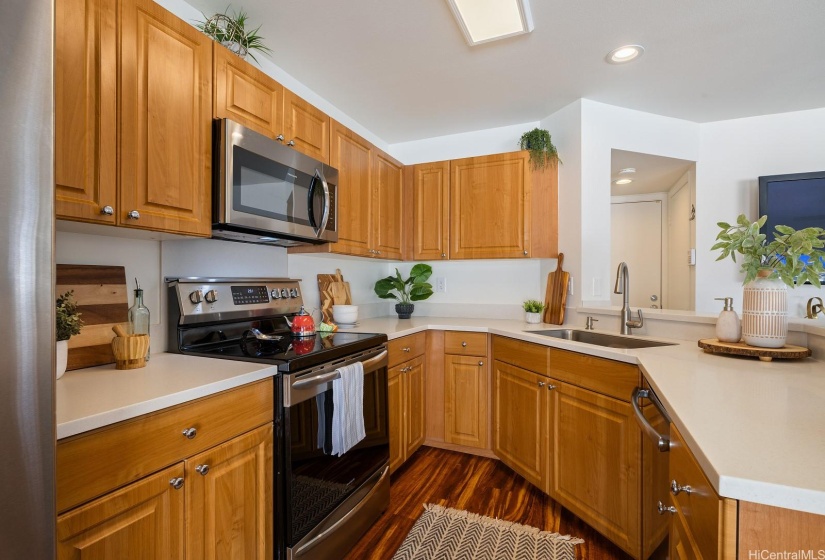 The kitchen features stainless steel appliances.