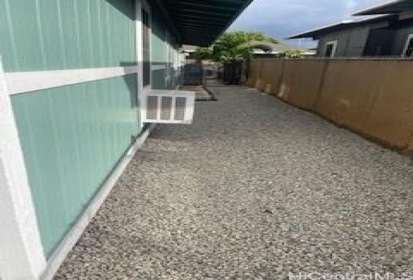 Side yard with an entrance to the kitchen