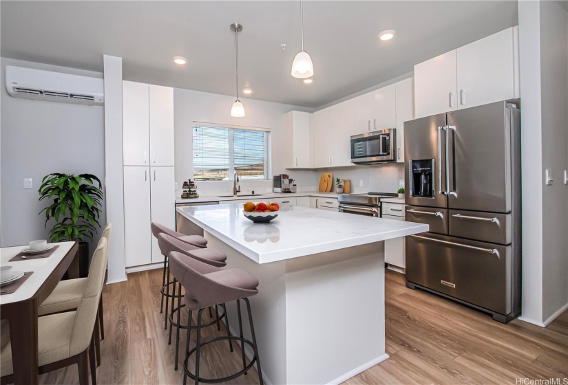 Virtually staged kitchen layout with dining area