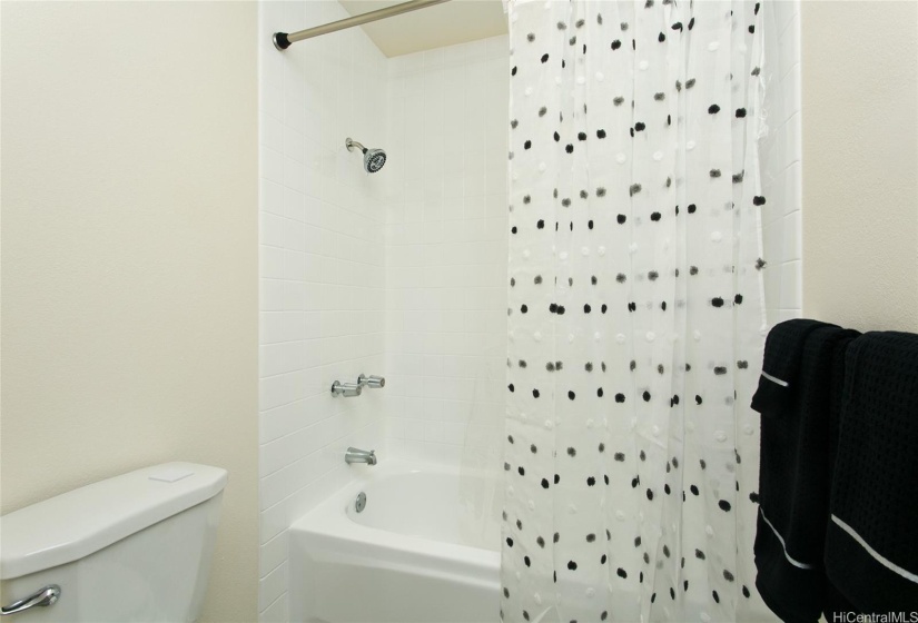 Shower over tub in main bathroom.