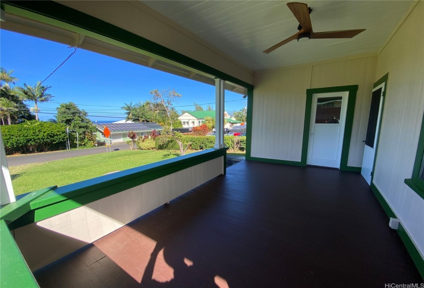 200 sq' covered lanai as you enter the home. The door on the right accesses the living area. The other door accesses the den/office space.