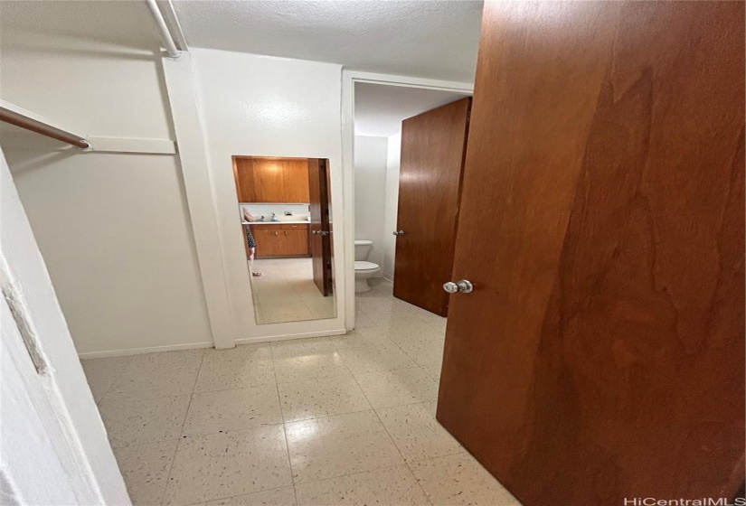 Closet area leading to bathroom.