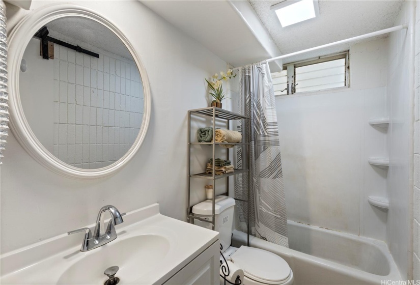 Remodeled bathroom with tub.