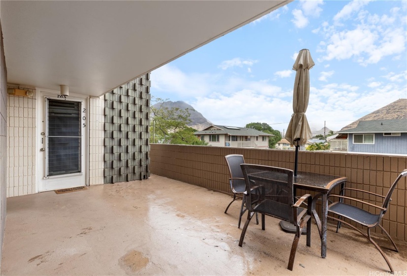 Added Outdoor area with mountain views by condo entrance.