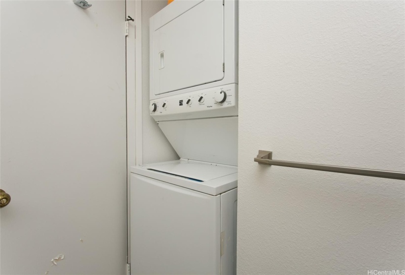 stacked washer/dryer in primary bathroom
