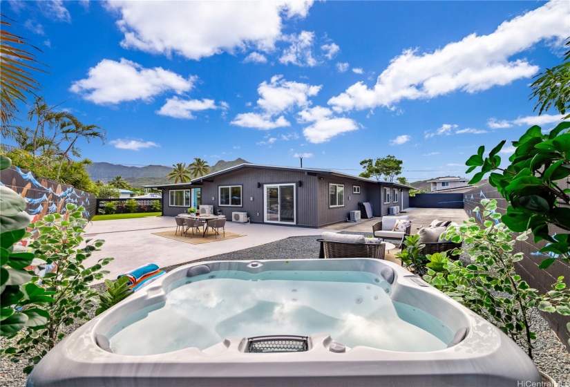 HUGE Property that beckons you to Relax & Unwind Day or Night in YourJacuzzi! Take in the Ko'olau Mountain Views. Massive Yard Spaces & EntertainingAreas throughout the Property. This special spot has a Sliding Door Access from thePrimary Bedroom too!