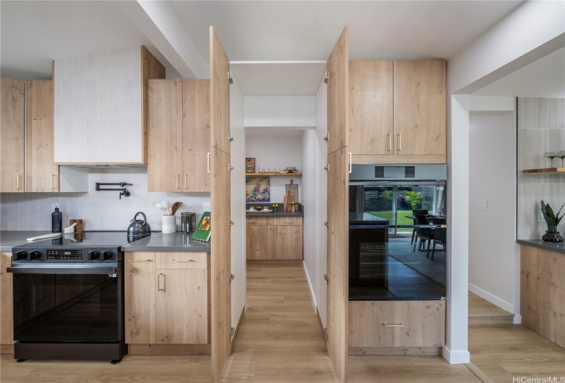 Top Notch Appliances & Tastefully Designed Butler Pantry that Transitions into theInternal Laundry Room