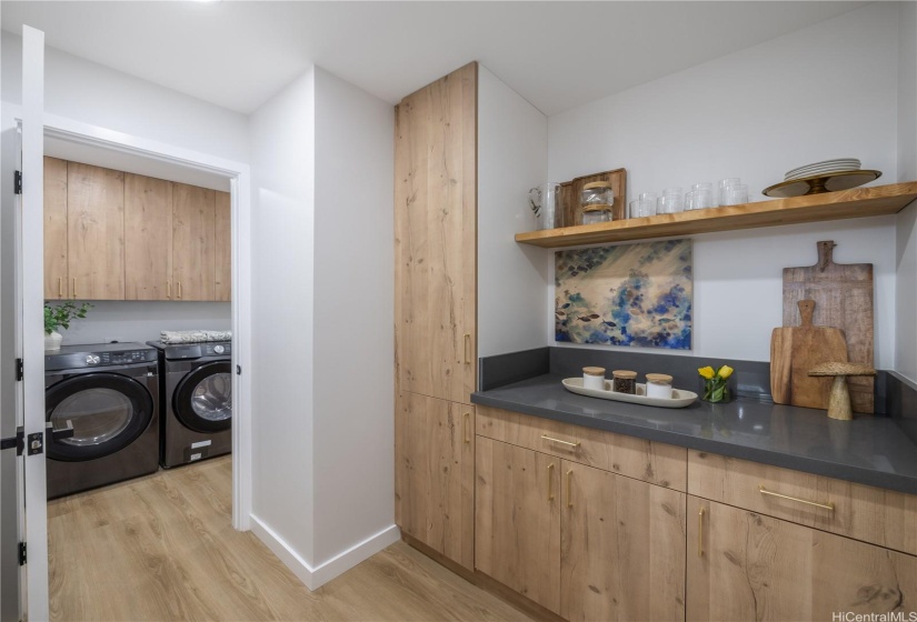 Seamless & Strategical Transitions from Garage Door through Laundry Room intoButlers Pantry which can be accessed from Kitchen...Design with Functionality inMind at it's finest here in this Kailua home!