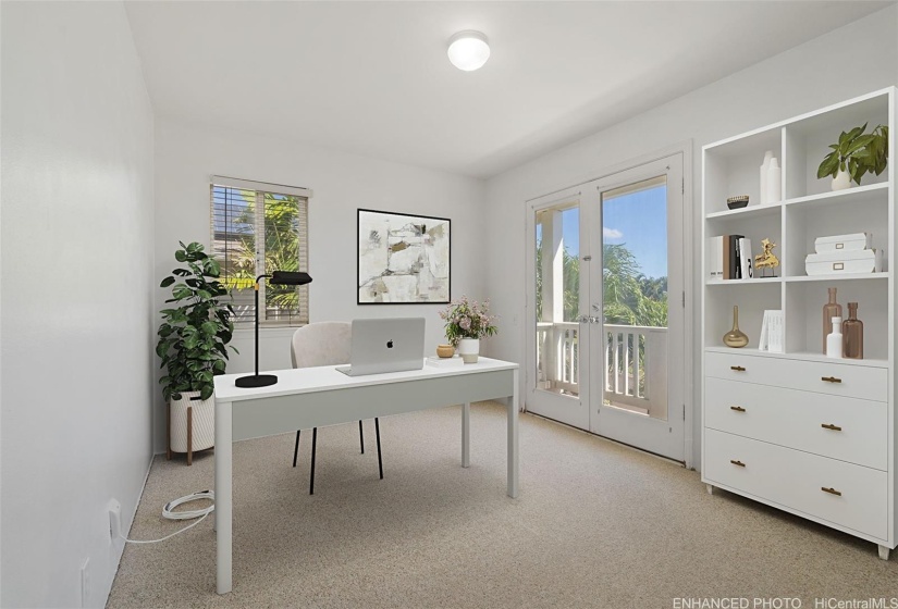 Front bedroom opens onto charming Juliet balcony. Enhanced with virtual staging.