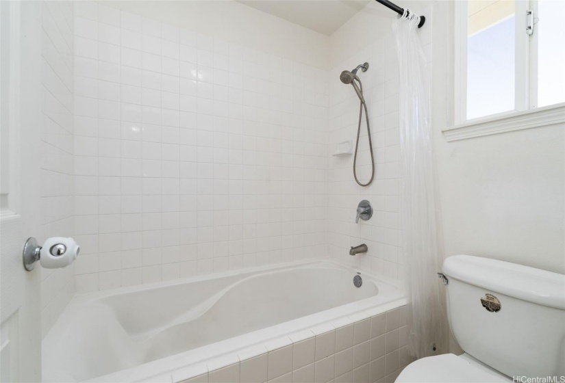 Primary bath features large, deep tub.