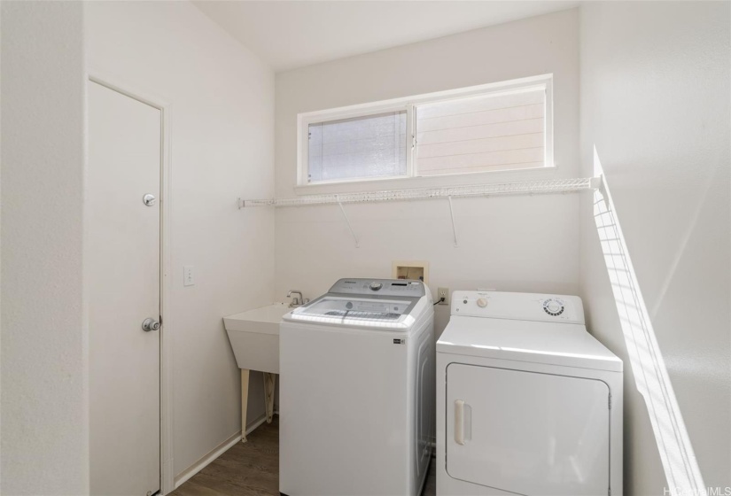 Laundry room is inside for convenience.