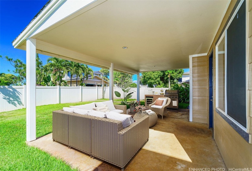 Covered lanai at the back of the house means you can enjoy true indoor/outdoor living. Enhanced with virtual staging.