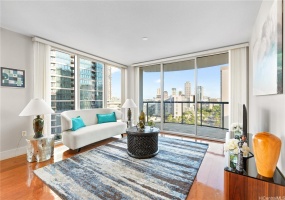 Modern Flair Living Room with hardwood flooring and spacious floor to ceiling windows.