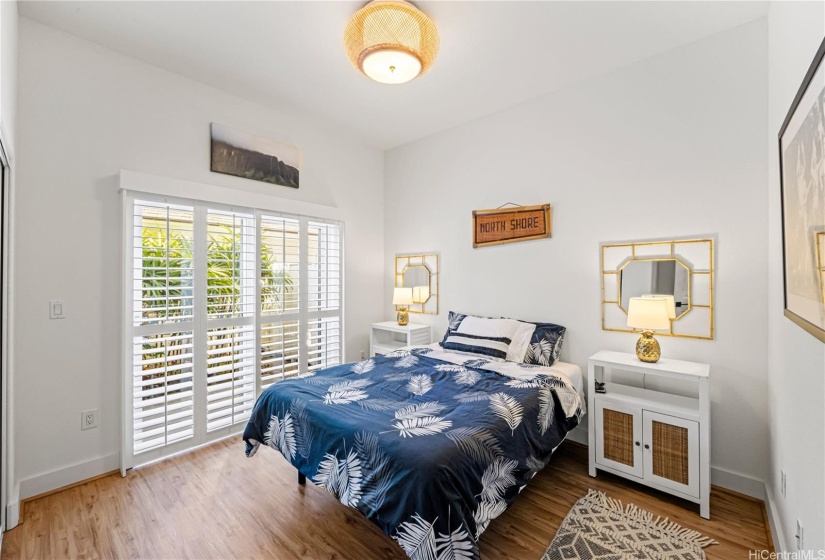 Bedroom #1 on the first floor has an adjacent private lanai + first floor full bath