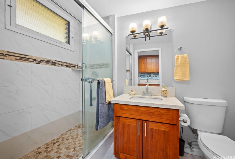 Renovated bathroom and walk in shower.