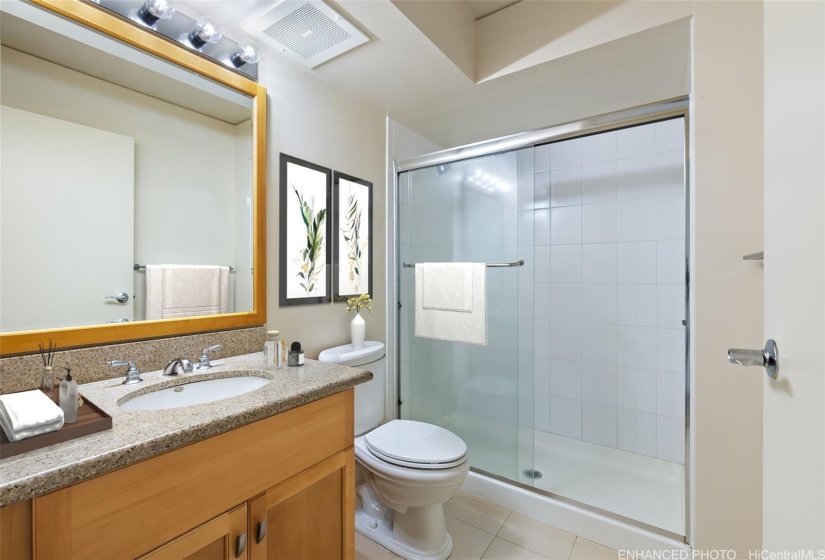 Primary bath for en-suite primary bedroom.  (Enhanced photo)