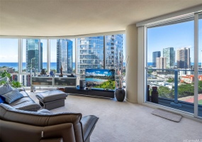 Enjoy views of the cityscape and ocean from the comfort of the living room.