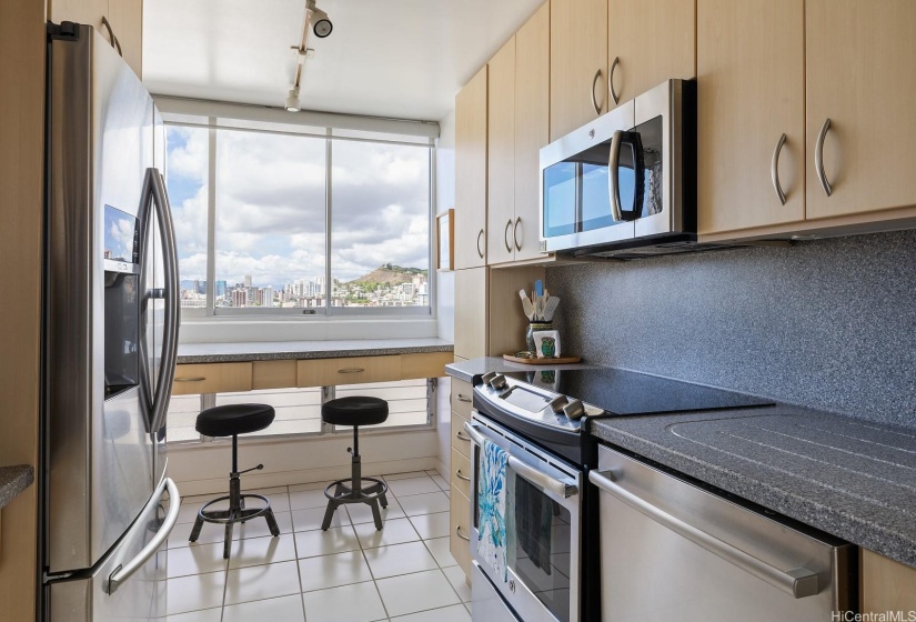 Breakfast nook in kitchen for morning coffee and avocado toast.  Appliances are in pristine condition.  Kitchen looks brand new!