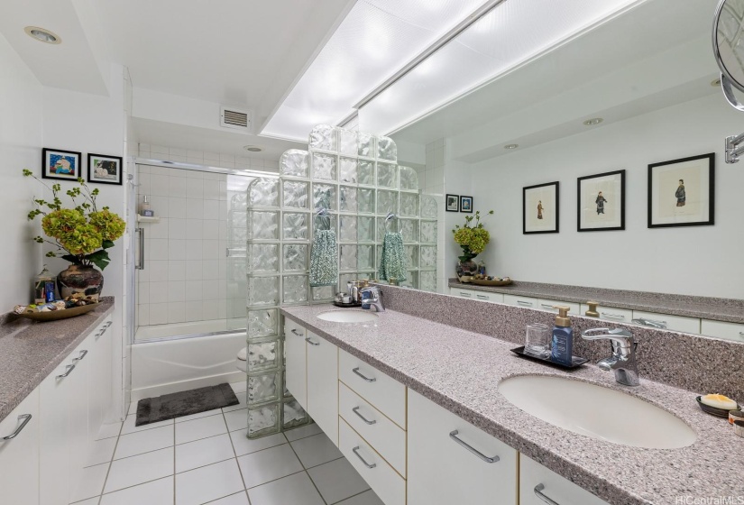 Customized bathroom with double sinks in primary bathroom.  Lots of storage and dressing.