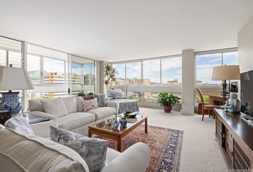 Electronic roll down shades help manage the light in this room.