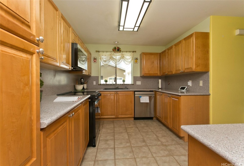 BRAND NEW  KITCHEN APPLIANCES.  Lots of counter-space w/ excellent condition cupboards.  CHECK OUT GRANITE DOUBLE SINK.