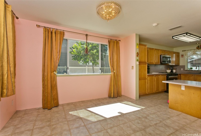 Living room highlighted by Swarovski Crystal Chandelier for elegant dining.