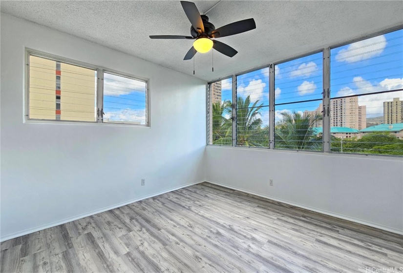 Primary bedroom allows cool trade wind breezes and lots of natural light