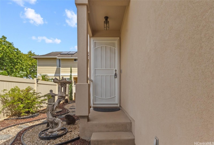 Front door entrance with access to the side/back yard
