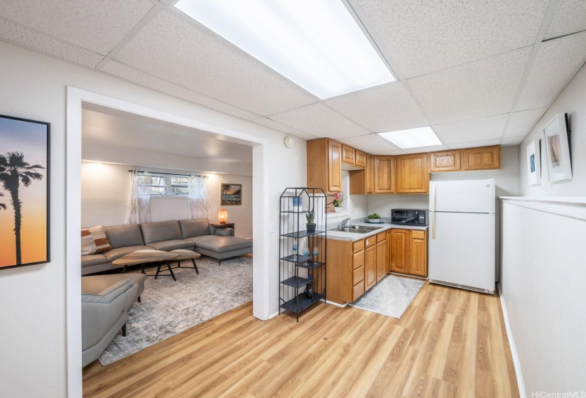 The downstairs 1/1 unit has a kitchenette that is spacious and functional.  The second private entrance to this space enters into this kitchenette area.