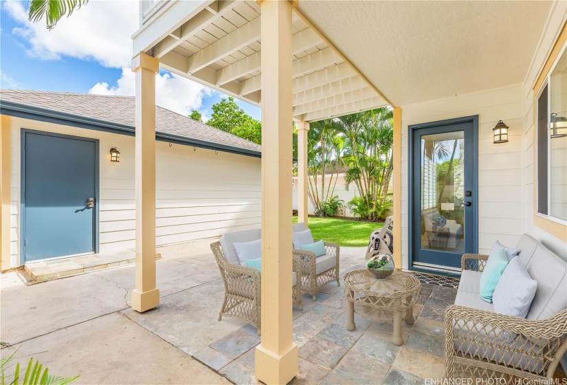 One or more photos have been enhanced. Outdoor patio with lanai above.