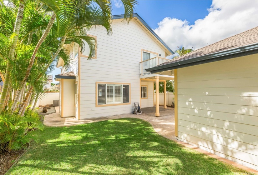 Spacious, fully fenced, backyard. Garage is on the right.