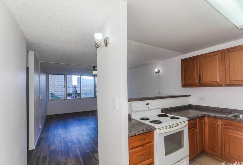 Cozy, functional kitchen with a brand new refrigerator, ideal for everyday cooking and meal prep